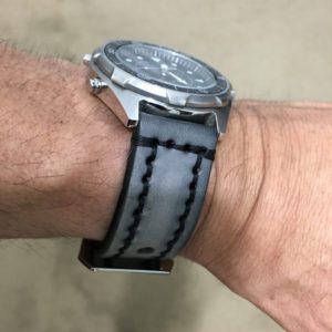 casio watch with gray stitched watchband