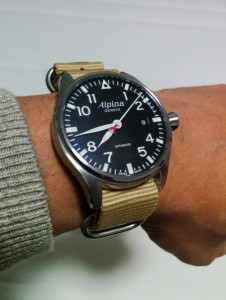 Beige nato strap on pilot watch.