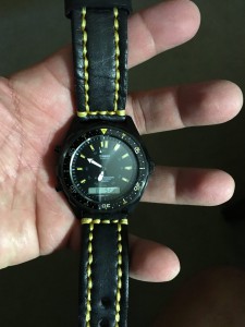 black watch band with yellow stitching