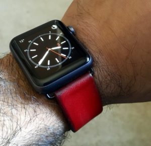 Black Apple Watch Sport with vintage red leather band